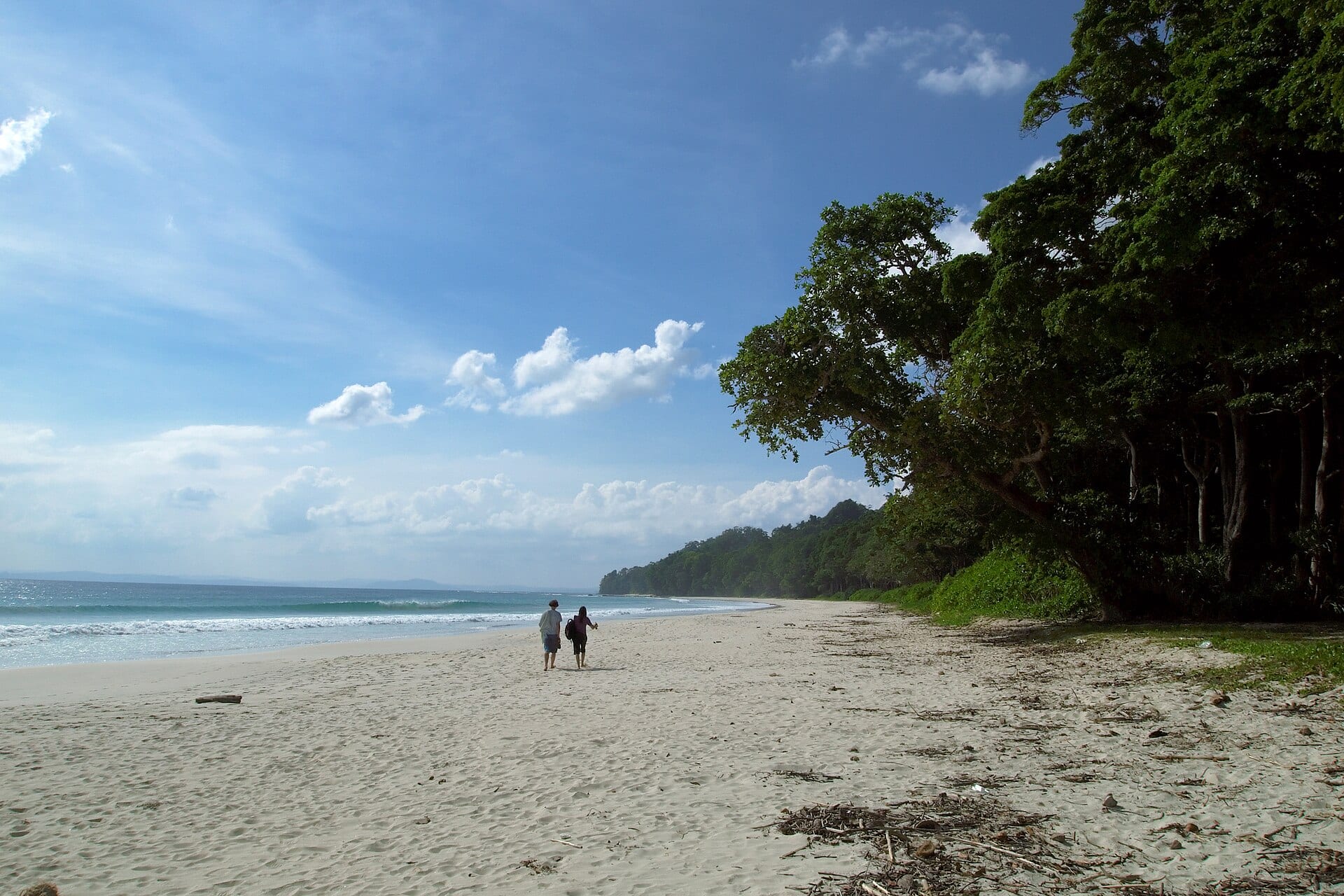 Quiet tropical beach with clear shallow water
