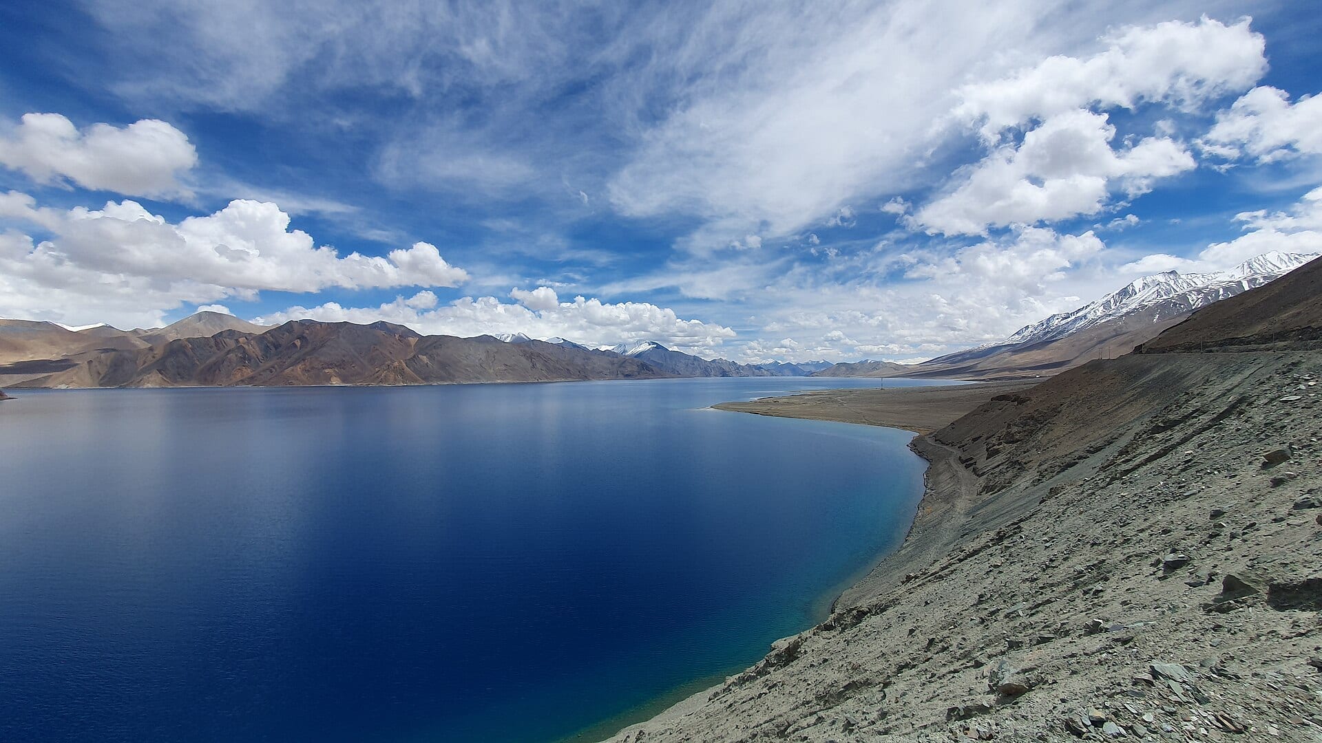 High-altitude lake surrounded by bare mountains